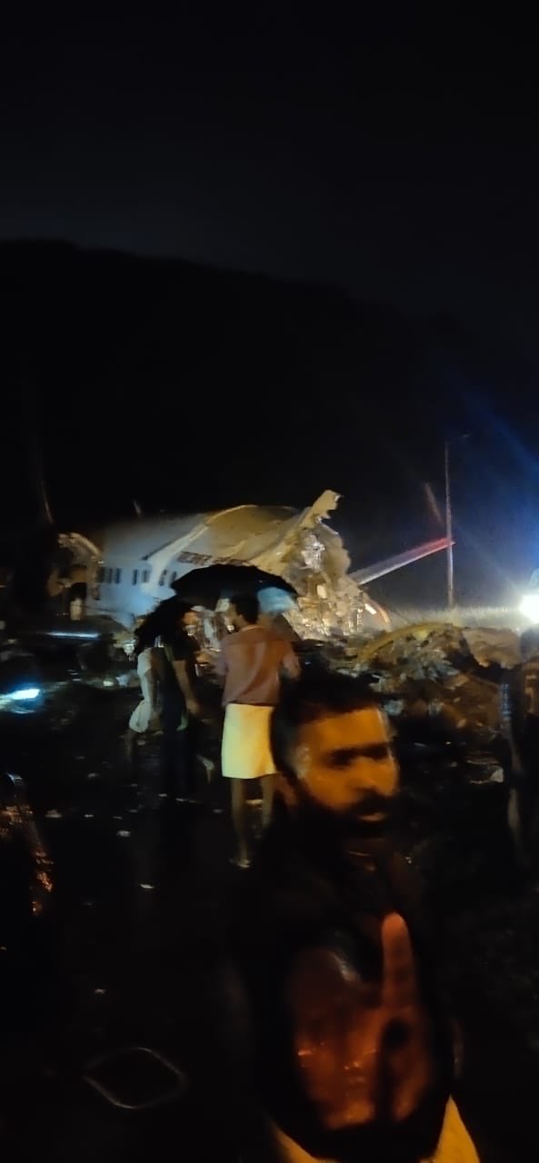Air India Express plane broke into two pieces after skidding off end of runway